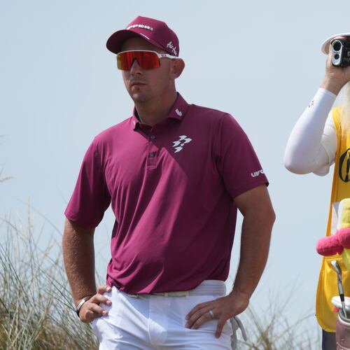 Lucas Herbert of Australia with his caddie Nick Pugh, look at the 13th hole from the tee during the second day of the British Open Golf championships at Royal Birkdale golf club, in Southport, England, Friday, July 17, 2026. (AP Photo/Jon Super)