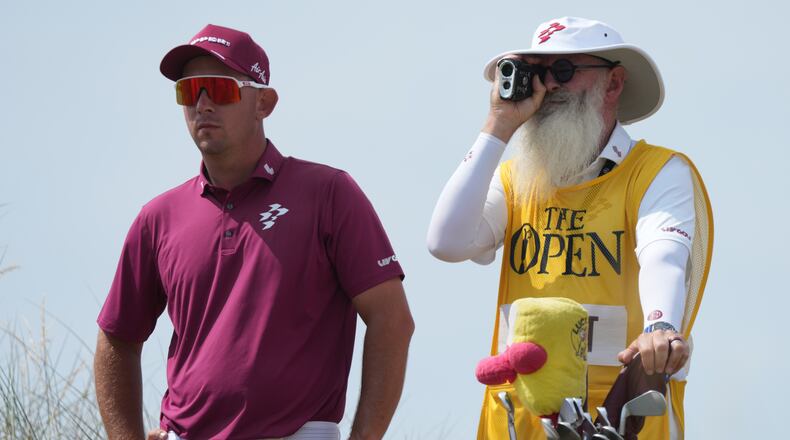 Lucas Herbert of Australia with his caddie Nick Pugh, look at the 13th hole from the tee during the second day of the British Open Golf championships at Royal Birkdale golf club, in Southport, England, Friday, July 17, 2026. (AP Photo/Jon Super)