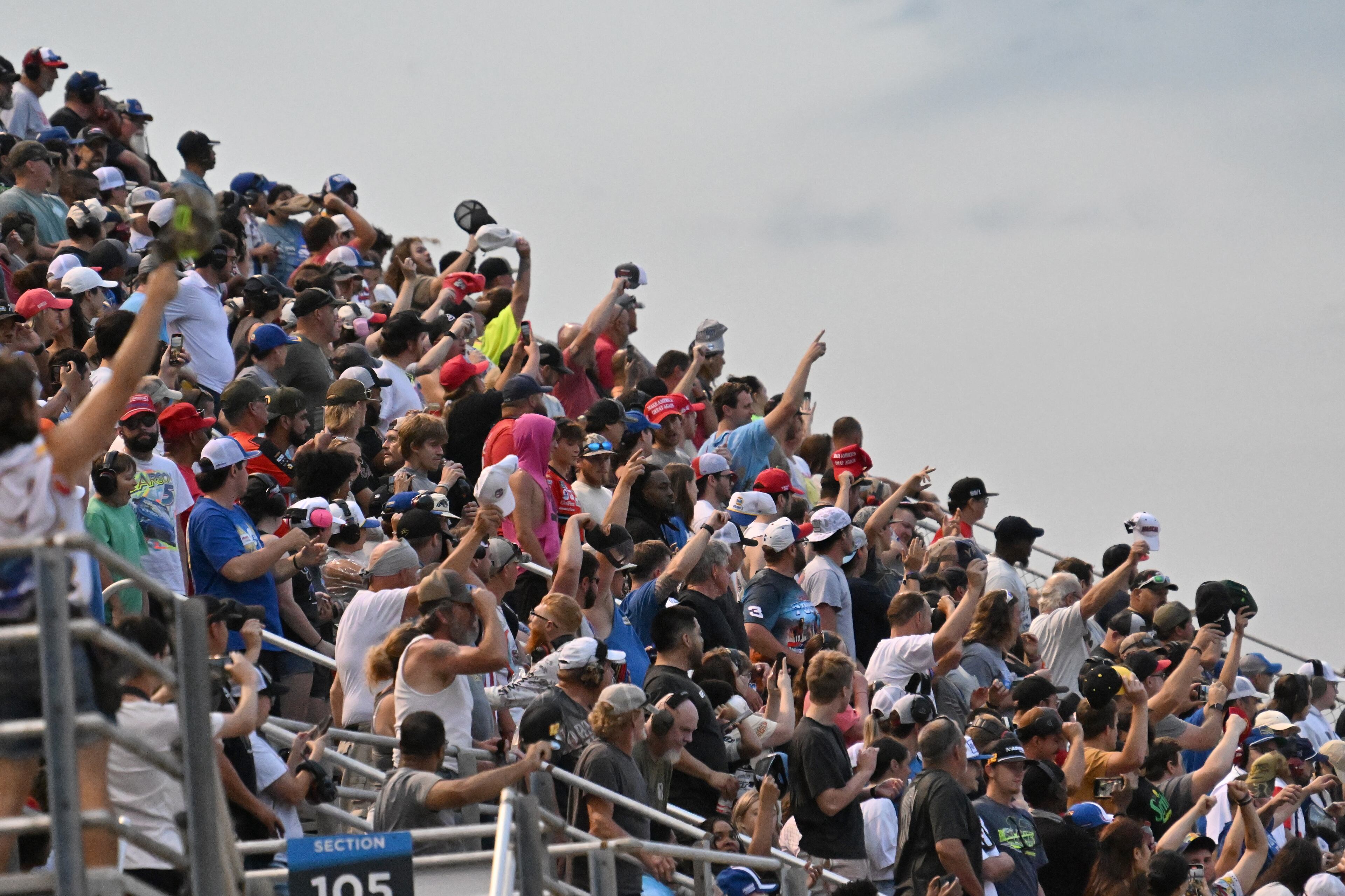 NASCAR fans cheer during Quaker State 400 NASCAR Cup Series race at EchoPark Speedway, Saturday, June 28, 2025, in Hampton. (Hyosub Shin / AJC)