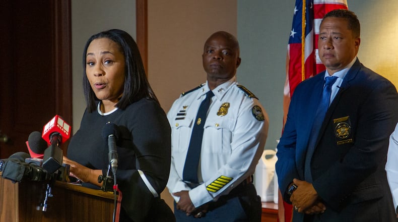 Fulton County District Attorney Fani Willis (L) speaks at a press conference with Fulton County Sheriff Patrick Labat (R) and then-Atlanta Police Chief Rodney Bryant on May 10, 2022. (Steve Schaefer / steve.schaefer@ajc.com)