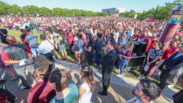 The day after an active shooter on campus Florida State held a vigil on campus at Langford Green, Tallahassee, Fla., Friday, April 18, 2025. (AP Photo/Gary McCullough)