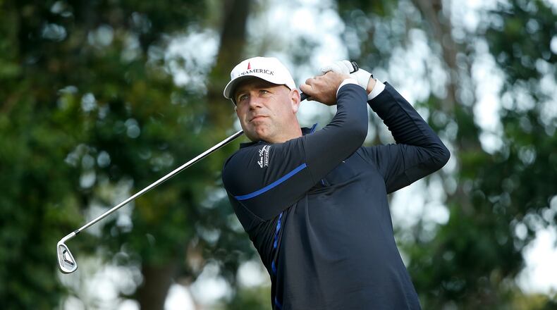 Stewart Cink tees off on the third hole at the Innisbrook Copperhead course in Thursday's first round of the Valspar Championship.  (Michael Reaves/Getty Images)