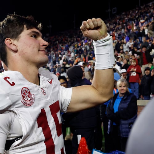 Alabama quarterback Ty Simpson celebrates after a win over Auburn in an NCAA college football game, Saturday, Nov. 29, 2025, in Auburn, Ala. (AP Photo/Butch Dill)