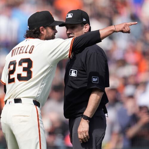 San Francisco Giants manager Tony Vitello (23) gestures after being ejected by umpire David Rackley, right, during the seventh inning of a baseball game between the Giants and the New York Mets in San Francisco, Sunday, April 5, 2026. (AP Photo/Jeff Chiu)