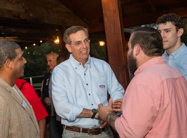 Secretary of State Brad Raffensperger (second from left) is in his second term.