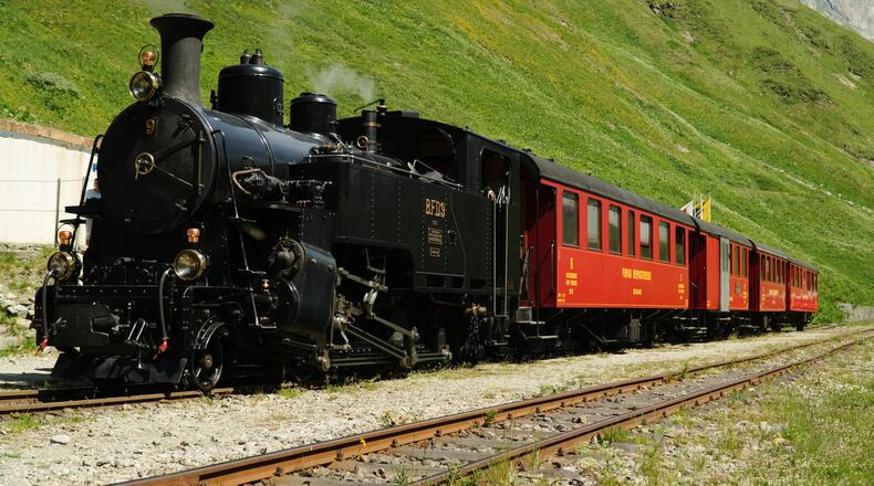 One of DFB's historic steam trains travels from Realp to Oberwald during a stop at the Furka station, Switzerland, Friday, June 26, 2026. (AP Photo/Niccolo Lupone)