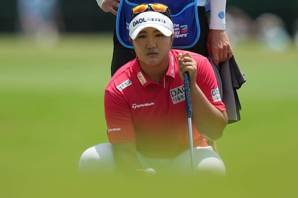 Haeran Ryu, of South Korea, lines up a putt on the eighth hole during the third round of the Chevron Championship LPGA golf tournament Saturday, April 26, 2025, in The Woodlands, Texas. (AP Photo/Eric Gay)