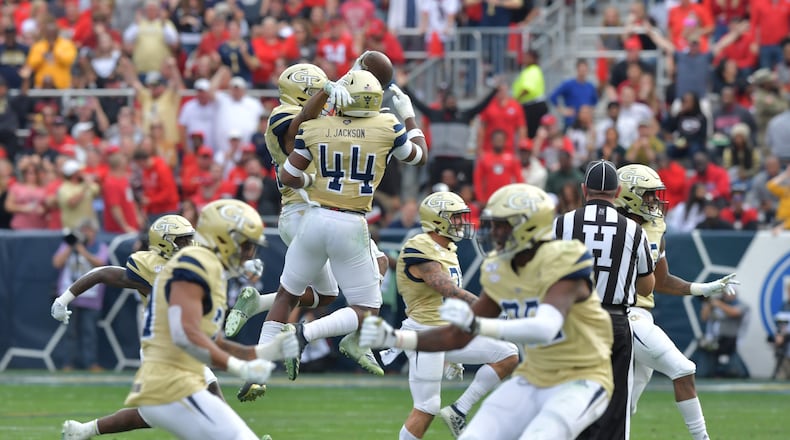 November 30, 2019 Atlanta - Georgia Tech players react after they recovered a fumble scores a touchdown during the first half of an NCAA college football game at Bobby Dodd Stadium on Saturday, November 30, 2019. (Hyosub Shin / Hyosub.Shin@ajc.com)