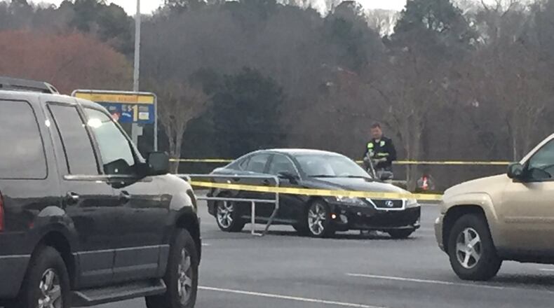 A woman was found inside a car after a deadly grocery store shooting. (credit: Channel 2 Action News)