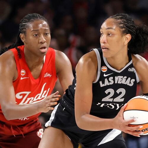 Indiana Fever center-forward Aliyah Boston, left, defends against Las Vegas Aces center A'ja Wilson (22) during the first half of an WNBA basketball game Sunday, July 12, 2026, in Las Vegas. (Steve Marcus/Las Vegas Sun via AP)