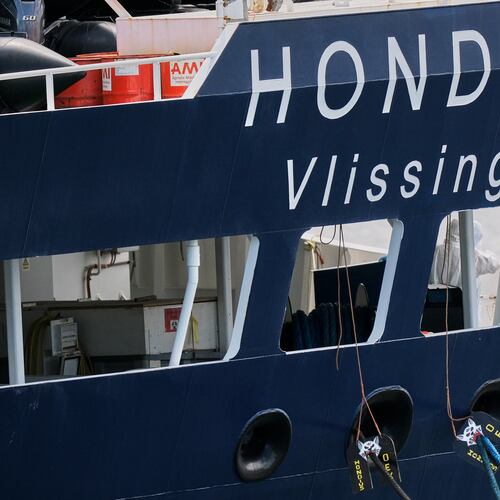 A crew in protective gear works on the MV Hondius cruise ship after its arrival at the Port of Rotterdam, Netherlands, Monday, May 18, 2026. (AP Photo/Patrick Post)