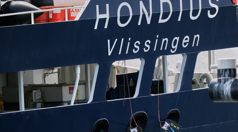 A crew in protective gear works on the MV Hondius cruise ship after its arrival at the Port of Rotterdam, Netherlands, Monday, May 18, 2026. (AP Photo/Patrick Post)