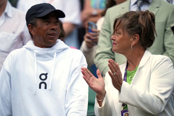 Shelton's parents, Bryan Shelton and Lisa Witsken Shelton, applaud after Ben Shelton of the U.S. won his men's singles third round match against Marton Fucsovics of Hungary at the Wimbledon Tennis Championships in London, Saturday, July 5, 2025.(AP Photo/Alastair Grant)
