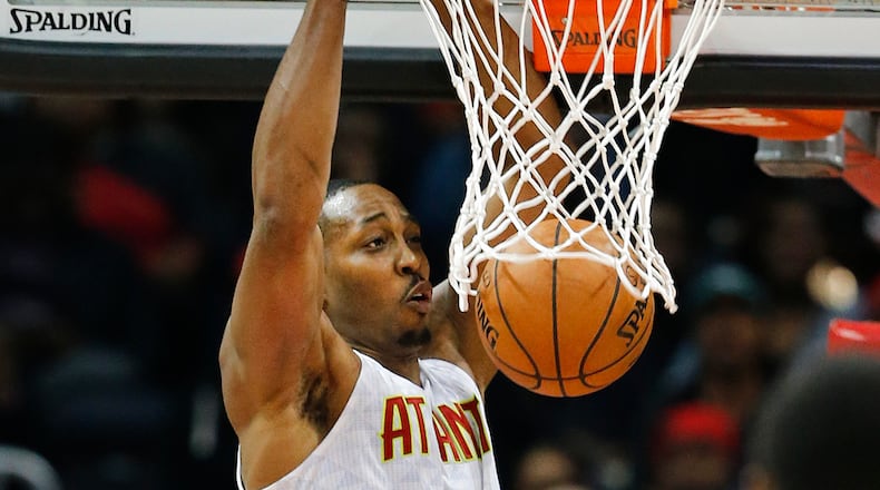 Atlanta Hawks center Dwight Howard (8) scores against the Chicago Bulls during the second half of an NBA basketball game Wednesday, Nov. 9, 2016, in Atlanta. Atlanta won 115-107. (AP Photo/John Bazemore)
