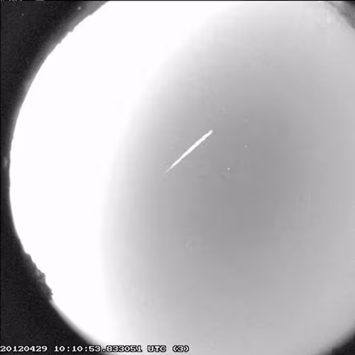 FILE - This photo provided by NASA shows an Eta Aquarid meteor streaking over northern Georgia on April 29, 2012. (B. Cooke/Marshall Space Flight Center/NASA via AP, File)