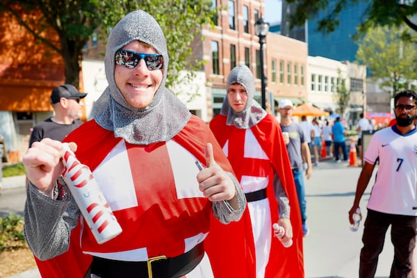 England fans dressed in traditional attire gather in downtown Atlanta before a FIFA World Cup round of 32 match at Atlanta Stadium (Mercedes-Benz Stadium) on Wednesday, July 1, 2026. (Miguel Martinez/AJC)