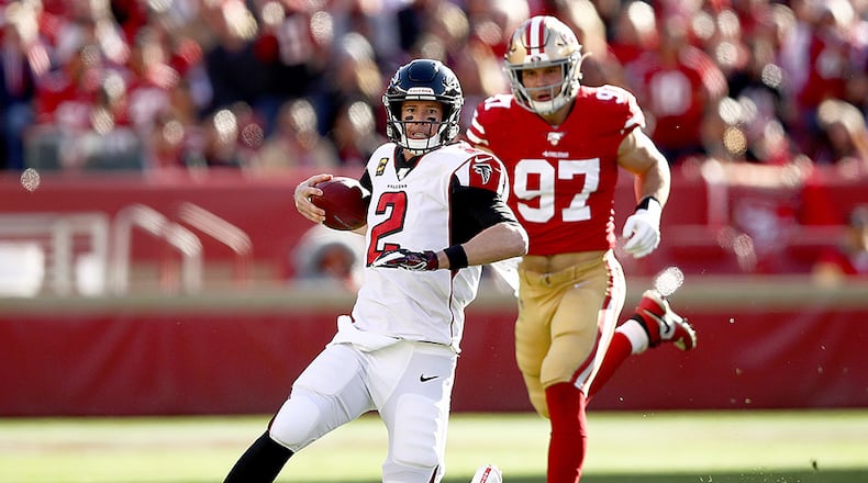 Falcons quarterback Matt Ryan slides ahead of 49ers defensive end Nick Bosa Sunday, Dec. 15, 2019, at Levi's Stadium in Santa Clara, Calif.
