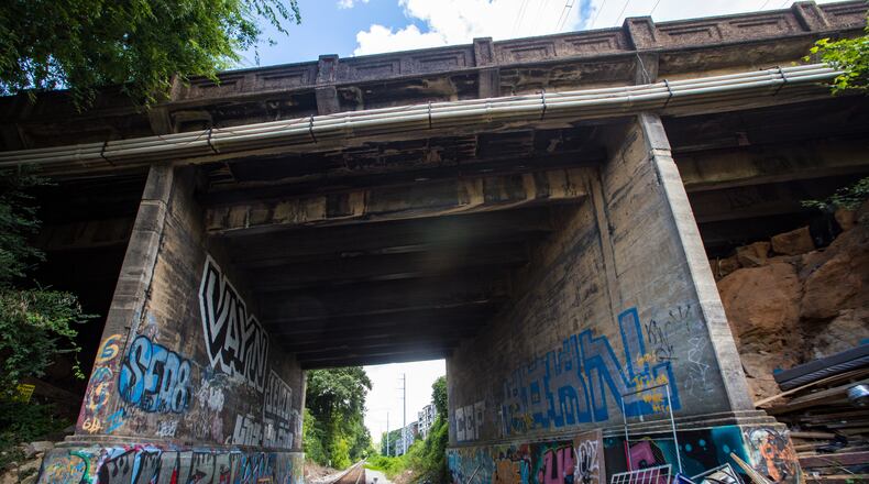 The northern portion of the Beltline will be the final section completed after designers work out how to deal with active rail lines.  The Peachtree Road bridge here, photographed Sunday, Aug. 15, 2021, runs over the active rail line just south of Bennett Street and has a very narrow clearance.  (Jenni Girtman for The Atlanta Journal-Constitution)