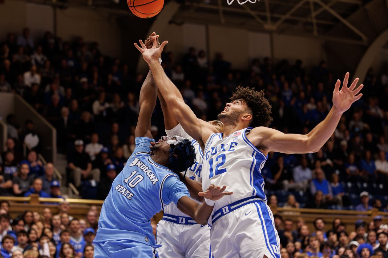 Duke's Cameron Boozer (12) and Indiana State's Enel St. Bernard (10) battle for a rebound during the first half of an NCAA college basketball game in Durham, N.C., Friday, Nov. 14, 2025. (AP Photo/Ben McKeown)