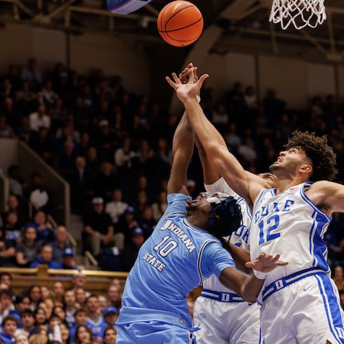 Duke's Cameron Boozer (12) and Indiana State's Enel St. Bernard (10) battle for a rebound during the first half of an NCAA college basketball game in Durham, N.C., Friday, Nov. 14, 2025. (AP Photo/Ben McKeown)