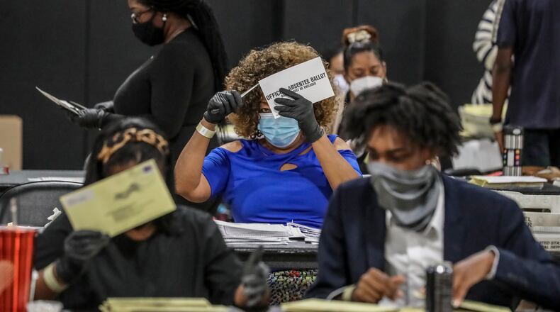 August 11, 2020 Atlanta: Some 70 Fulton County Registration & Election Board workers handled some 20,000 absentee ballots on Tuesday, August 11, 2020 at State Farm Arena located at 1 State Farm Drive in Atlanta. A heated race for Fulton County district attorney saw a light turnout at the polls on Tuesday, August 11, 2020. Incumbent Paul Howard faces his former chief deputy, Fani Willis, in a closely watched contest to become the county’s top prosecutor. Election officials said they learned lessons from the June 9 primary to avoid the kind of extreme lines that some voters encountered last time. Poll workers have been retrained. Technicians were on hand at every voting location in Cobb, DeKalb, Fulton and Gwinnett counties. Voting machines were delivered well in advance of election day. Still, some voters experienced problems and long waits at the polls. Nearly 377,000 Georgians already voted in advance of election day, most of them casting absentee ballots. About 60% of early votes were absentee; the rest were cast in person during three weeks of early voting. With so many voters using absentee ballots, election results might be slow to come in Tuesday night. Absentee ballots will be counted if they’re received by county election officials before 7 p.m., but each ballot has to be fed through a scanner to be counted, a process that can take days. Election officials say it’s normal for absentee vote-counting to take some time. But that means close races might not be settled on election night. The winners of Tuesday’s runoffs will advance to the general election in November, when turnout is expected to break records and exceed 5 million voters. JOHN SPINK/JSPINK@AJC.COM