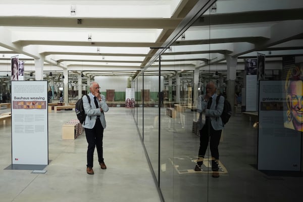 A visitor observes the Museum of Survivors, located in a factory where Oskar Schindler saved some 1200 Jews during the WWII, in Brnenec, Czech Republic, Saturday, May 10, 2025. (AP Photo/Petr David Josek)