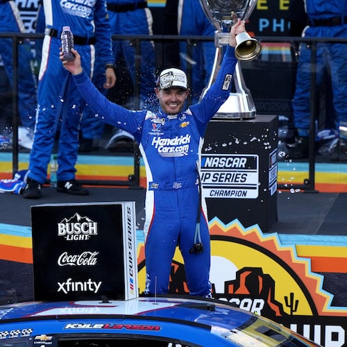 Kyle Larson celebrates after winning the NASCAR Cup Series championship Sunday, Nov. 2, 2025, in Avondale, Ariz. (AP Photo/Rick Scuteri)