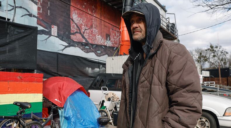 Will Bittler, who said he worked for decades as an electrician and has been homeless for about five months, stands near his tent behind a building on Cheshire Bridge Road in Atlanta on Friday, Dec. 29, 2023. (Natrice Miller/Atlanta Journal-Constitution/TNS)