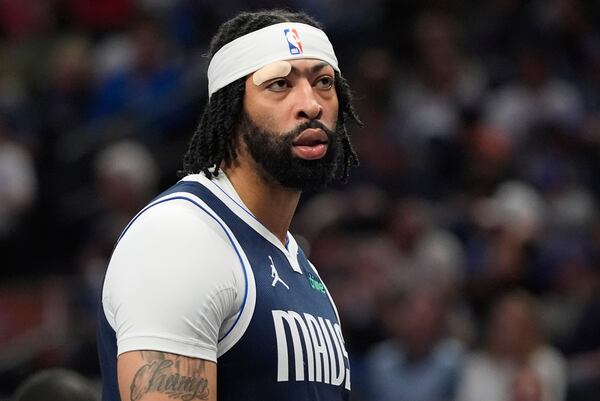 Dallas Mavericks forward Anthony Davis plays with a cut above his eye bandaged during the first half of an NBA basketball game against the Atlanta Hawks in Dallas, Wednesday, April 2, 2025. (AP Photo/LM Otero)