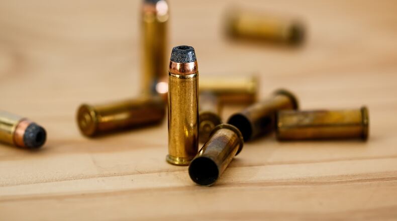 A man who was shot twice in the left thigh told police he was unloading his gun.