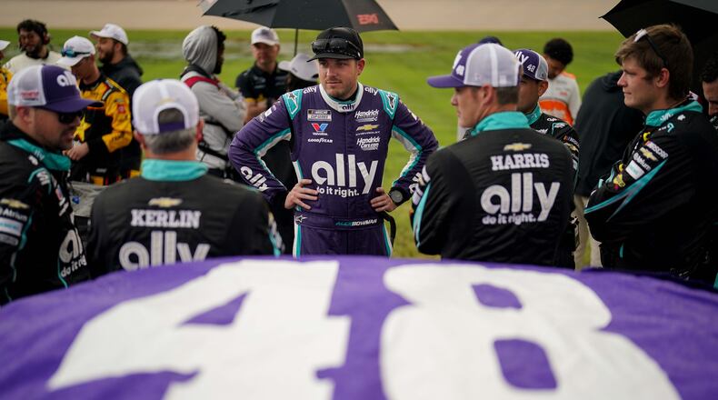 Alex Bowman, center, stands with his team before a NASCAR Cup Series auto race, Sunday, May 31, 2026, in Lebanon, Tenn. (AP Photo/Camden Hall)