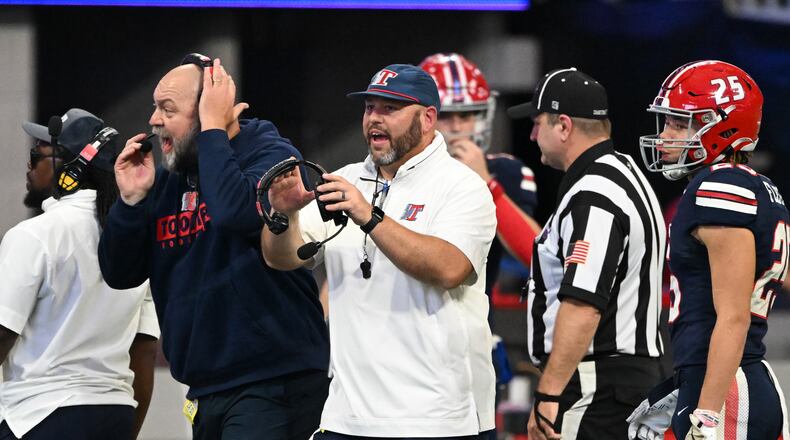 Toombs County and coach Buddy Martin (center) — pictured during last season's Class A Division I championship game — continue their bid for a repeat when they host Thomasville on Friday in the second round. Toombs is ranked No. 2 and Thomasville is No. 5. (Hyosub Shin/AJC 2024)