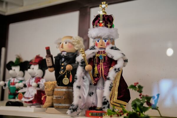 A nutcracker commemorating the coronation of Britain's King Charles III, right, stands alongside other nutcrackers at the Steinbach-Volkskunst nutcracker factory in Marienberg, Germany, Tuesday, April 15, 2025. (AP Photo/Markus Schreiber)