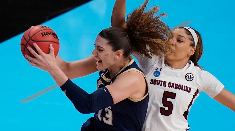 Georgia Tech forward Lorela Cubaj (13) grabs a rebound in front of South Carolina forward Victaria Saxton (5) during the first half of the Sweet Sixteen round of the women's NCAA Tournament Sunday, March 28, 2021, at the Alamodome in San Antonio. (Eric Gay/AP)