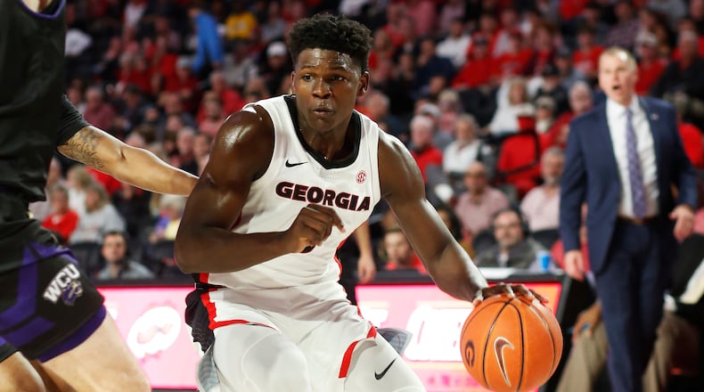 Georgia's Anthony Edwards (5) moves the ball against a Western Carolina defender during an NCAA college basketball game Tuesday, Nov. 5, 2019, in Athens, Ga. (Joshua L. Jones/Athens Banner-Herald via AP)