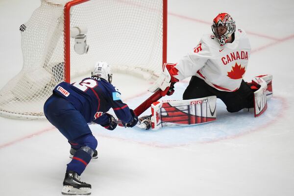 United States' Tessa Janecke scores a sucden death goal in overtime during the gold medal match between Canada and United States at the Women's Ice Hockey Championships in Ceske Budejovice, Czech Republic, Sunday, April 20, 2025. (AP Photo/Petr David Josek)