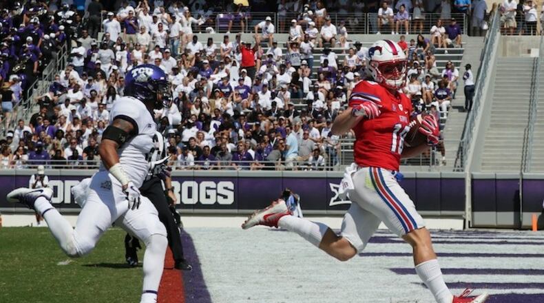This Sept. 16, 2017 file photo shows SMU wide receiver Trey Quinn (18) beating TCU safety Niko Small (2) to the end zone for a touchdown reception during the first half an NCAA college football game in Fort Worth, Texas. SMU has completed 94 passes over the last three games. Trey Quinn has been on the receiving end of 49. (AP Photo/LM Otero)