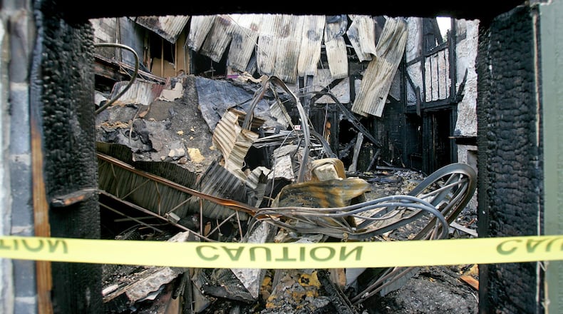 OCTOBER 5, 2005 ATLANTA/FULTON COUNTY - Wednesday morning a gutted building was all that remained of what once housed a gay nightclub bombed by Eric Rudolph by a fire Tuesday night. Atlanta fire dispatchers said no injuries were reported in the blaze, which broke out before 9 p.m. in the 1900 block of Piedmont Road, in the former home of the Otherside Lounge. On Feb. 21, 1997, a device described by police as a "projectile bomb" exploded in a back room of the nightclub, injuring four people. Investigators found and detonated a second bomb hung in shrubbery outside the club. Rudolph was captured in western North Carolina in 2003 and earlier this year pleaded guilty to theOtherside Lounge bombing as well as bombings at Centennial Olympic Park and abortion clinics in Sandy Springs and in Birmingham, Ala. He is serving four life sentences in federal prison. (JOHN SPINK/AJC staff)