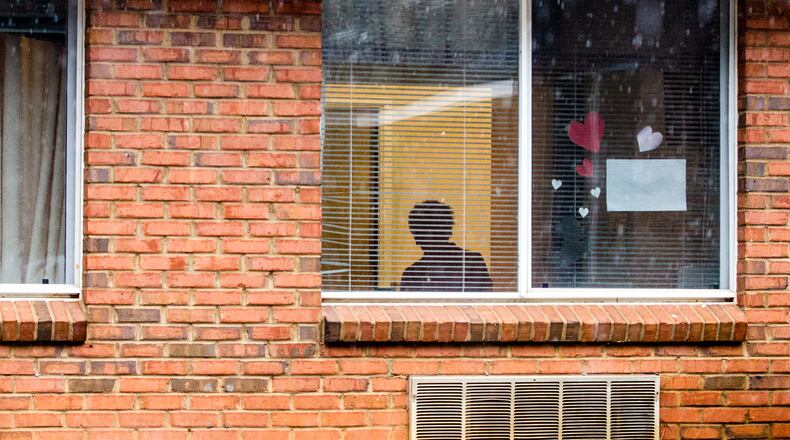 Hundreds of lawsuits against nursing homes blaming patient deaths on negligent care have been tossed out or languished in the courts amid contentious legal battles. Shown here, a resident inside a metro Atlanta nursing facility in February 2021. (Jenni Girtman for The Atlanta Journal-Constitution)