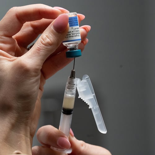 FILE - Lauren Ellenburg, a nurse, prepares a combination measles, mumps and rubella vaccine for a patient at Tiger Pediatrics in Easley, S.C., March 17, 2026. (AP Photo/Mary Conlon, File)