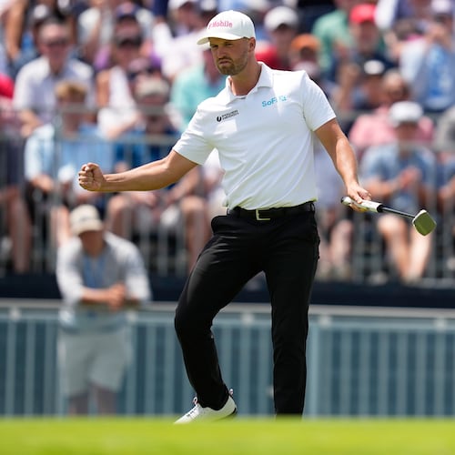 Wyndham Clark celebrates after a birdie on the 12th hole during the second round of the U.S. Open golf tournament at Shinnecock Hills Golf Club in Southampton, N.Y., Friday, June 19, 2026.(AP Photo/David J. Phillip)