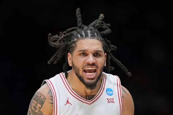 Houston's Emanuel Sharp celebrates during the second half in the Elite Eight round of the NCAA college basketball tournament against Tennessee Sunday, March 30, 2025, in Indianapolis. (AP Photo/Michael Conroy)