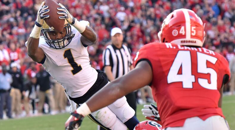 Georgia Tech running back Qua Searcy (1) dives into the end zone for a game-tying touchdown against Georgia in the fourth quarter of an NCAA college football game Saturday, Nov. 26, 2016, in Athens, Ga. Georgia Tech won 28-27. (Hyosub Shin/Atlanta Journal-Constitution via AP)