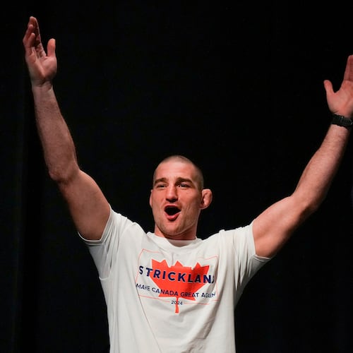 FILE - Sean Strickland, UFC middleweight champion, arrives on stage to face off with Dricus Du Plessis during a mixed martial arts news conference ahead of UFC 297 in Toronto, Thursday, Jan. 18, 2024. (Nathan Denette/The Canadian Press via AP, FIle)