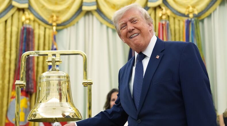 President Donald Trump rings the opening bell for the New York Stock Exchange and the Nasdaq in the Oval Office at the White House, Monday, July 6, 2026, in Washington. (AP Photo/Mark Schiefelbein)