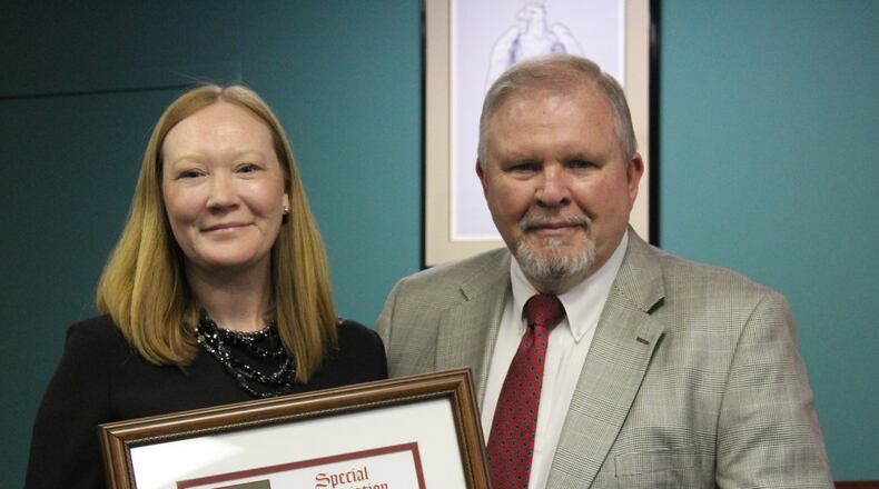 City Planner Keri Stevens was recognized as the city’s Employee of the Year in 2018. She is shown here with former Finance Director and Interim City Manager Ken Turner. Stevens, the first and only city planner in Avondale history, is leaving for a job in Gwinnett County. Courtesy City of Avondale Estates