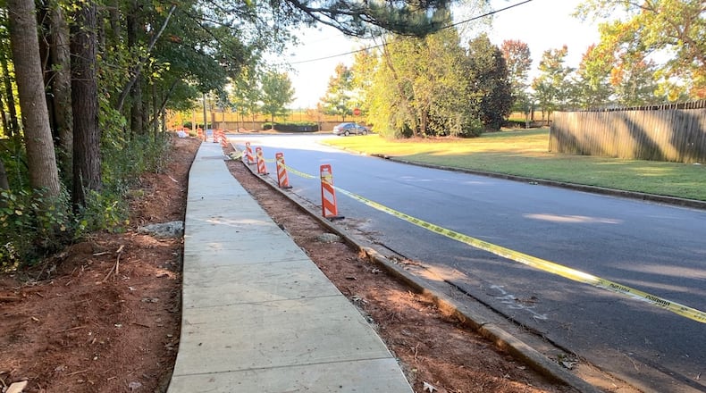 After completing a new stretch of sidewalk, Dunwoody Public Works is adding two new pedestrian refuge islands to busy roads. This safety enhancement was just completed at Windwood Hollow Park where the sidewalk is extended to connect the linear park. CONTRIBUTED