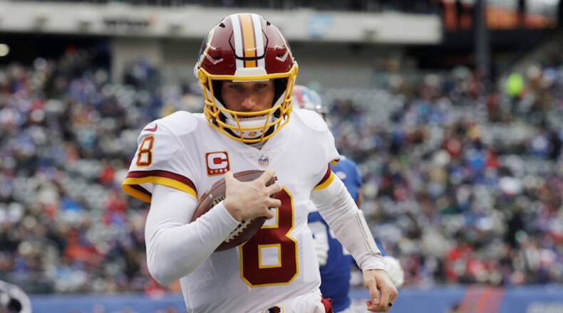 Washington Redskins quarterback Kirk Cousins (8) rushes for a touchdown during the first half of an NFL football game against the New York Giants Sunday, Dec. 31, 2017, in East Rutherford, N.J.  (AP Photo/Mark Lennihan)
