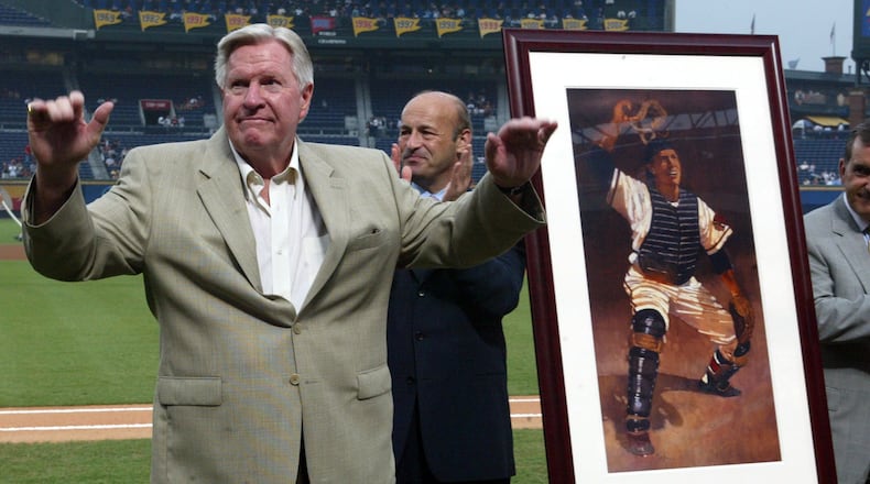 Braves Hall of Famer Del Crandall waves to the crowd after being presented with an drawing of himself in a presentation before game against the Padres Tuesday, Aug. 12, 2003, at Turner Field in Atlanta. (Phil Skinner/AJC)