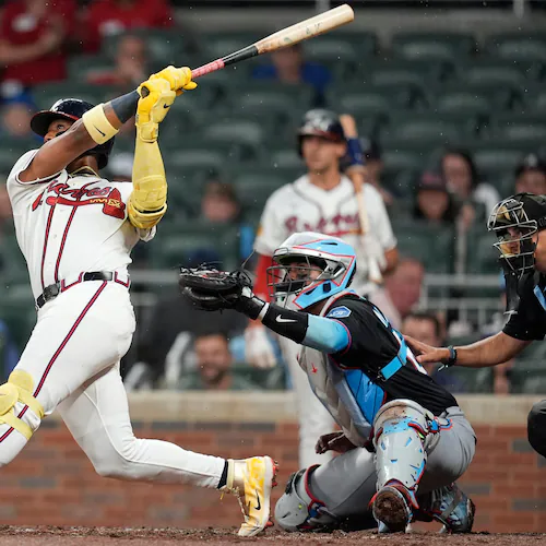 Atlanta Braves' Ronald Acuña Jr. (13) hits a two-run homer against the Miami Marlins in the third inning of a baseball game, Thursday, Aug. 6, 2026, in Atlanta. (AP Photo/Mike Stewart)